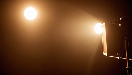 Photo of a street lamp on a dark background with a spot lightの素材