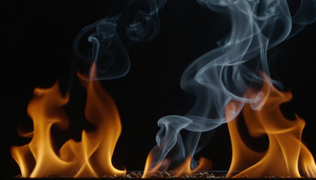 Fire flames isolated on black background. Abstract background. Close up.の素材