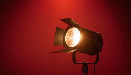 Studio lighting equipment on a red background. Studio lighting equipment on a red background.の素材