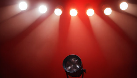 Spotlight on a red background with spotlights. Lighting equipment.の素材