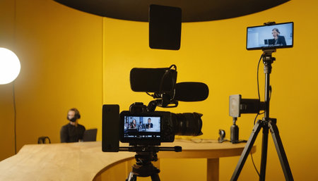 Cameraman recording a podcast in a conference room, focus on cameraの素材