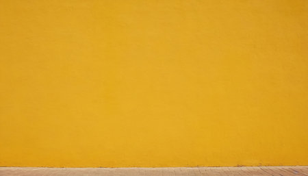 Yellow concrete wall and floor with wooden plank. Abstract background for design.の素材