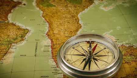 Compass on a map of the world. Conceptual image.の素材