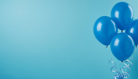 Blue balloons on blue background with copy space. Birthday, anniversary, celebration concept.の素材