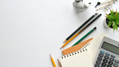 Top view of office desk table with calculator, supplies and copy space.の素材