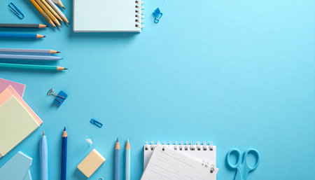 School supplies on blue background. Back to school concept. Copy space.の素材