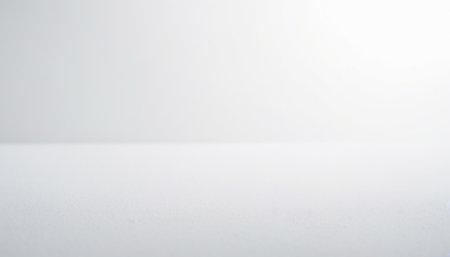 Empty white table in front of white wall background and copy space.の素材