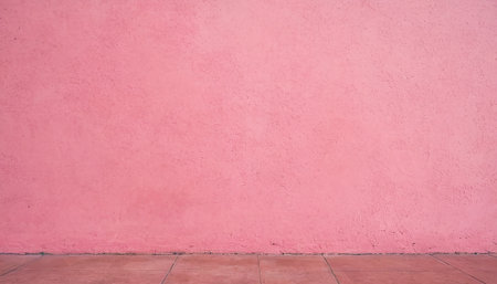 Pink cement wall and wooden floor background with copy space for design.の素材