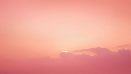 Nature background. Fluffy soft clouds in sky toned pink colorの素材