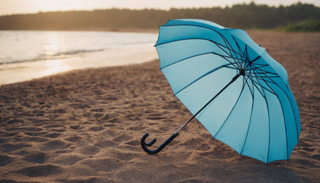 Blue umbrella on the beach at sunset. Vacation and travel conceptの素材