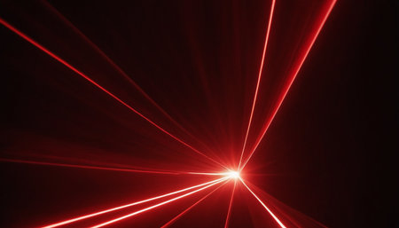 Red laser rays on a dark background. Bright rays of light.の素材