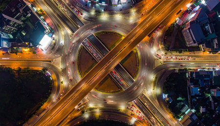Aerial view of highway road junction in Hong Kong city at nightの素材