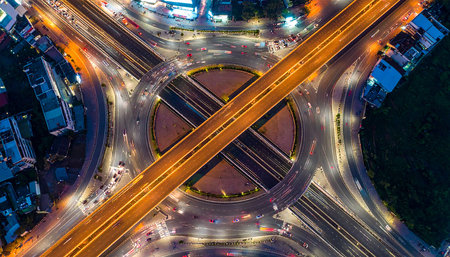 Aerial view of highway road junction at night in Bangkok, Thailandの素材