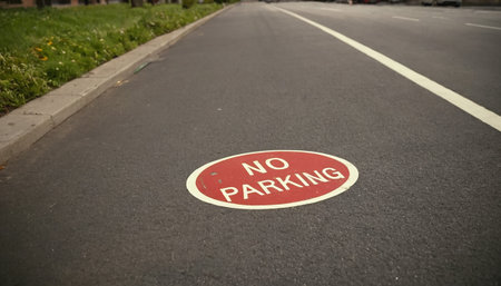 No parking sign on the road. Selective focus with shallow depth of field.の素材