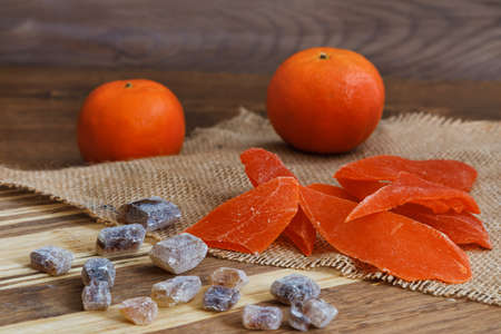 Candied fruit on a wooden cutting board