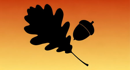 A stark black silhouette of an oak leaf and its acorn are set against a warm gradient of orange and yellow, evoking autumn.の素材