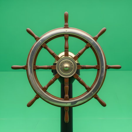 A detailed view of an antique ship's steering wheel made of wood and metal, set against a solid green backdrop.の素材