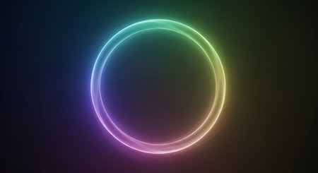 A glowing neon oval ring displays a spectrum of colors, from purple to green, against a deep black backdrop.の素材