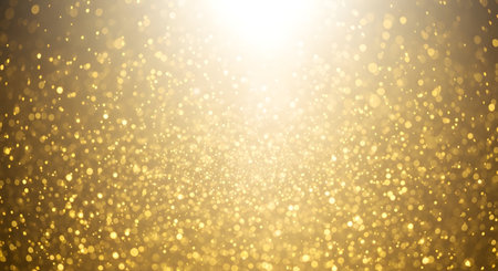 A dazzling, abstract background filled with shimmering golden glitter particles and a bright, ethereal light emanating from the top.の素材