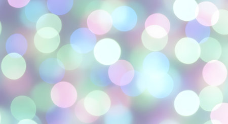 A dreamy, out-of-focus background featuring soft pastel bokeh lights in gentle hues of blue, pink, green, and purple.の素材
