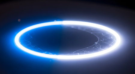 A bright, ethereal ring of light glows with blue and white hues against a deep, dark background, creating a mystical effect.の素材