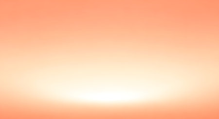 A warm, abstract background featuring a smooth gradient from peach to white, with a subtle pixelated effect.の素材