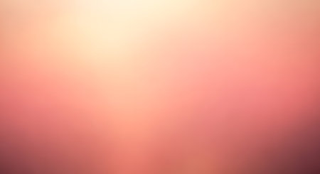 A gentle, abstract background composed of small, square pixels in a gradient of warm peach, pink, and soft yellow tones.の素材