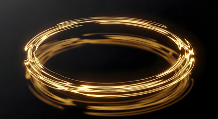 A close-up, abstract shot of bright golden light trails swirling in a circular motion against a dark background.の素材