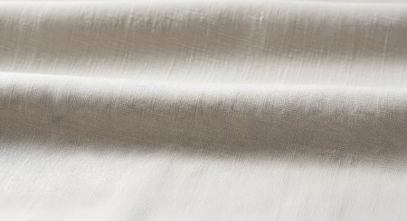 A detailed macro shot of a woven textile, showcasing its intricate texture and the interplay of light on its surface.の素材