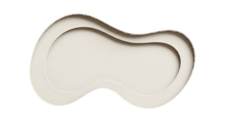 A smooth, white, curved gua sha tool designed for facial massage and skincare routines. Its ergonomic shape fits contours of the face.の素材