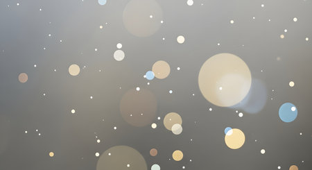A dreamy, soft focus background with scattered bokeh circles and tiny floating dust particles creating a magical atmosphere.の素材