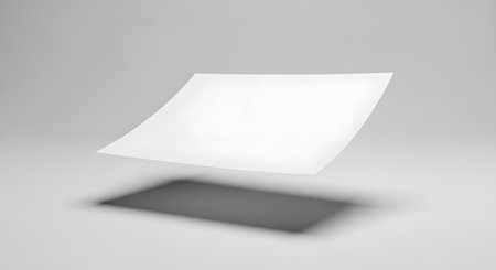 A clean, minimalist composition featuring a white square suspended in air above a dark, blurred rectangular shadow on a light gray background.の素材