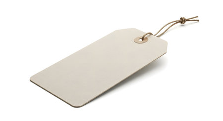 A blank beige paper tag with a rustic twine string is isolated on a white background, ready for personalization.の素材