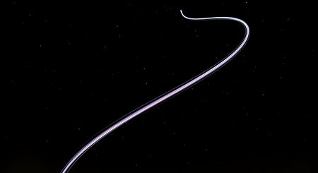 A close-up, high-magnification image of a single human hair strand, showing its texture and structure against a stark black backdrop.の素材