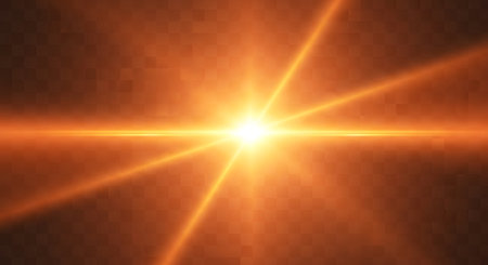 A brilliant, glowing starburst with radiating light beams and a lens flare effect against a dark, checkered background.の素材