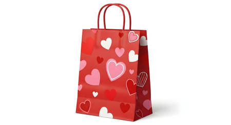 A tall, red paper gift bag adorned with a pattern of pink and white hearts is shown against a white background.の素材