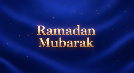 Elegant golden lettering spells out Ramadan Mubarak against a dark blue, textured background with subtle light beams and shimmering particles.の素材