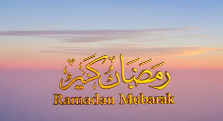 Beautiful golden Arabic calligraphy for Ramadan Mubarak is displayed prominently against a soft, pastel sunset sky with wispy clouds.の素材