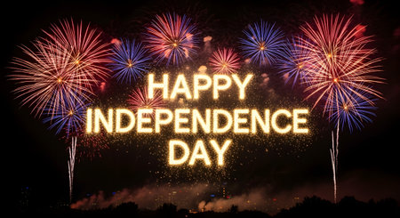 A dazzling night sky illuminated by colorful fireworks, spelling out 'Happy Independence Day' in glowing letters.の素材