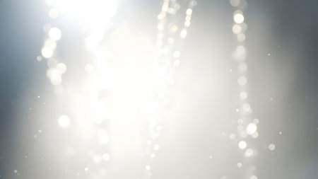 This image features a mesmerizing display of white lights against a gray background, creating a sense of depth and luminosity. The lights are scattered and blurred, giving the impression of movement and energy. The overall effect is one of dynamic visual interest, making it suitable for various design applications.の素材