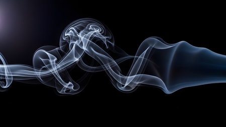 The image depicts a mesmerizing display of white smoke swirling and flowing against a stark black background, creating a captivating visual effect.の素材