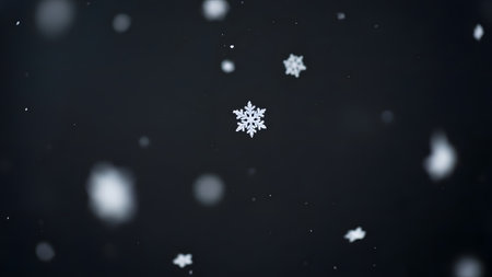 A serene image of snowflakes gently falling against a dark, blurred background, evoking a sense of winter wonder and tranquility.の素材