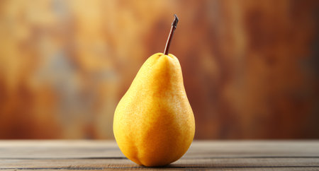 Ripe yellow pear on wooden table against blurred background, closeupの素材