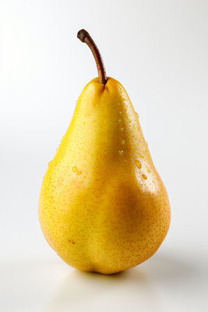 Ripe yellow pear on a white background. Close-up.の素材