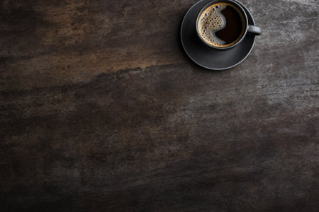 Coffee cup on wooden table. Top view with copy spaceの素材