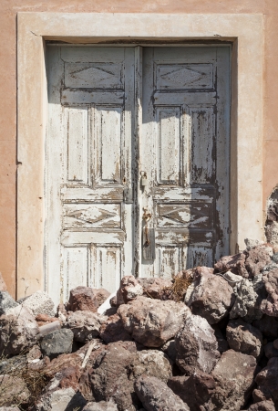 Door with lava rocks in front of it, Santorini,  South Aegean, Greeceの写真素材