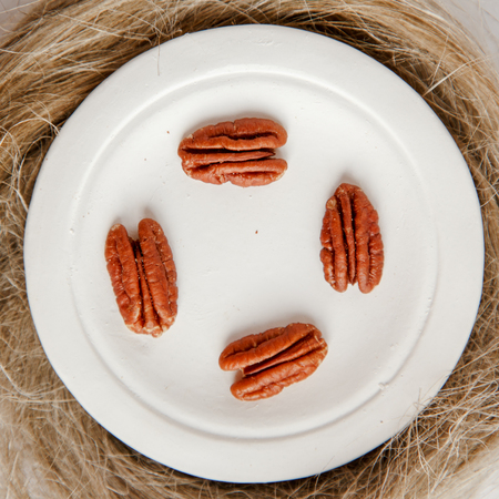 Pecan nuts on a plateの写真素材