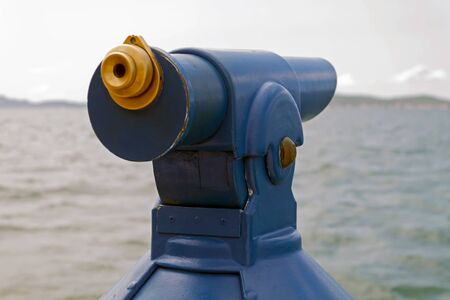 Coin operated binocular on the beach