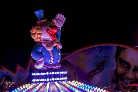 Sokobanja, Serbia- August10th 2019: Plastic clown figure on the top of carousel, local festive by night. Photo taken on August 10th 2019.のeditorial素材