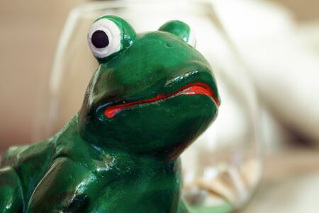 ceramic frog figurine with red mouthsの写真素材
